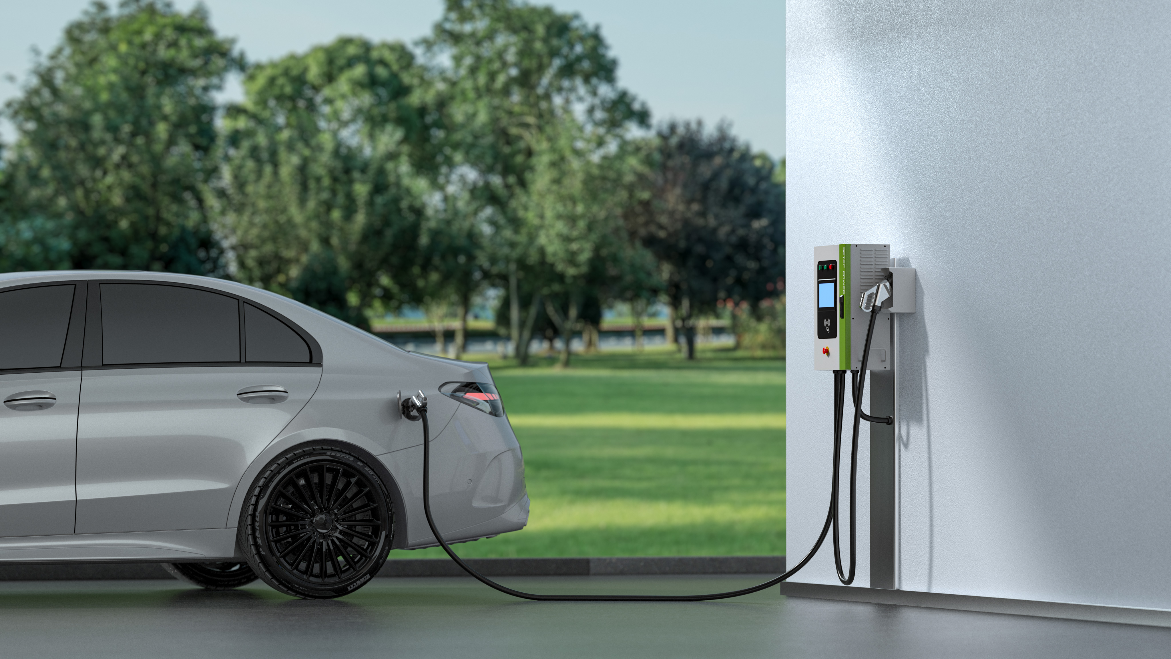 A wall-mounted Level 2 EV charging station plugged into an electric vehicle in a clean garage showing the 240V EVSE setup.
