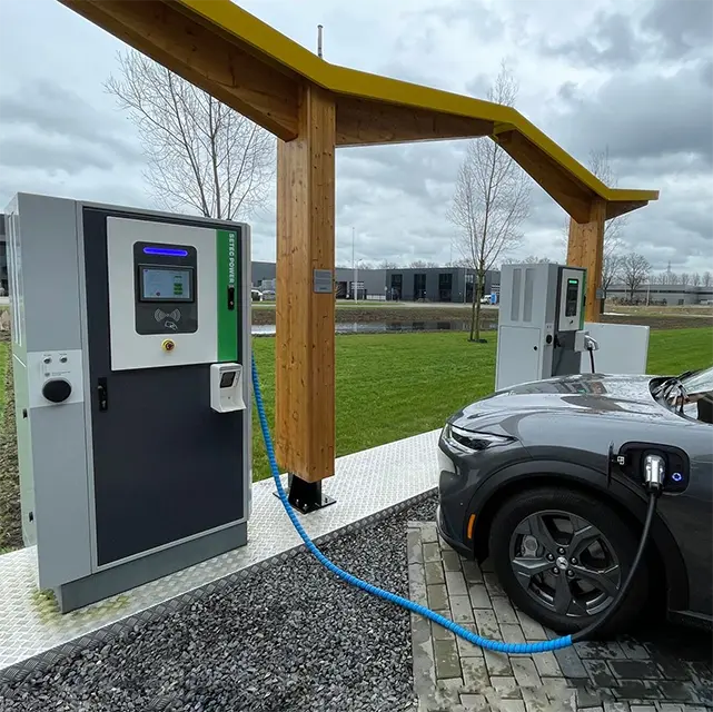 Gray EV charging under a wooden canopy at a corporate charging station