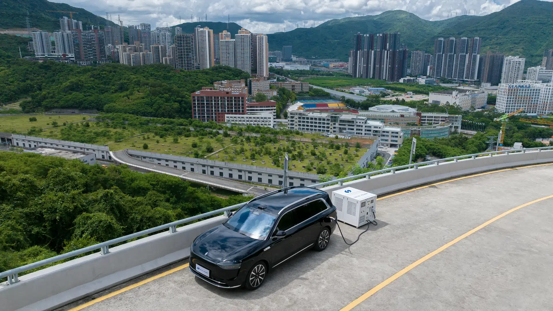 Mobile EV fast charging station system powering a smart electric vehicle on an outdoor roadside location, highlighting high power density and adaptive fleet mobility solutions by SETEC POWER.