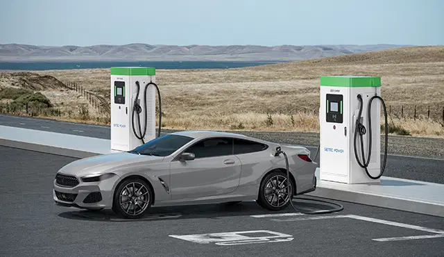 An electric vehicle plugged into a high-power public DC fast charging station on a cold winter day, illustrating charging speed variables.